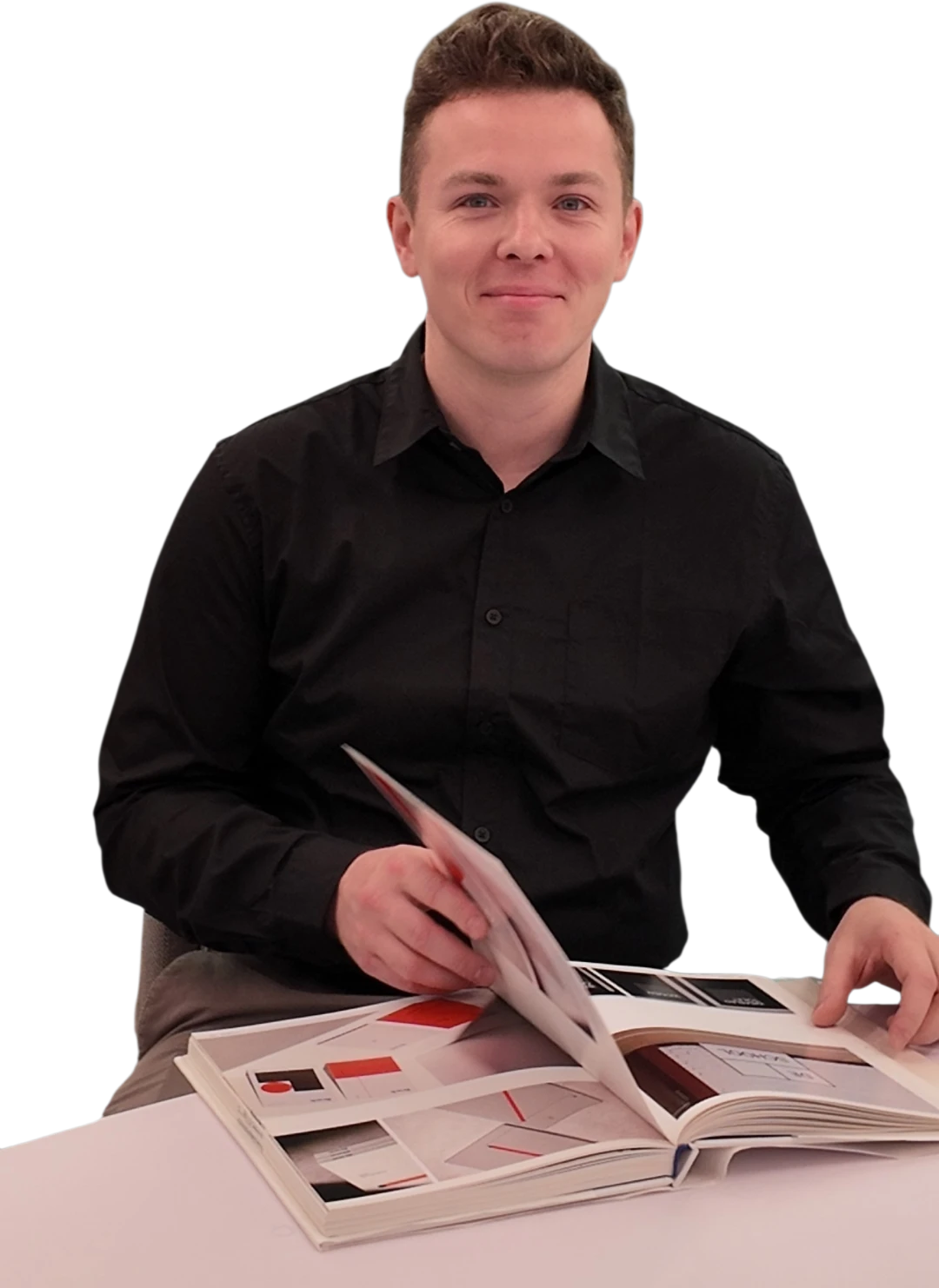 Nikita Metelitsa reviewing an architecture monograph